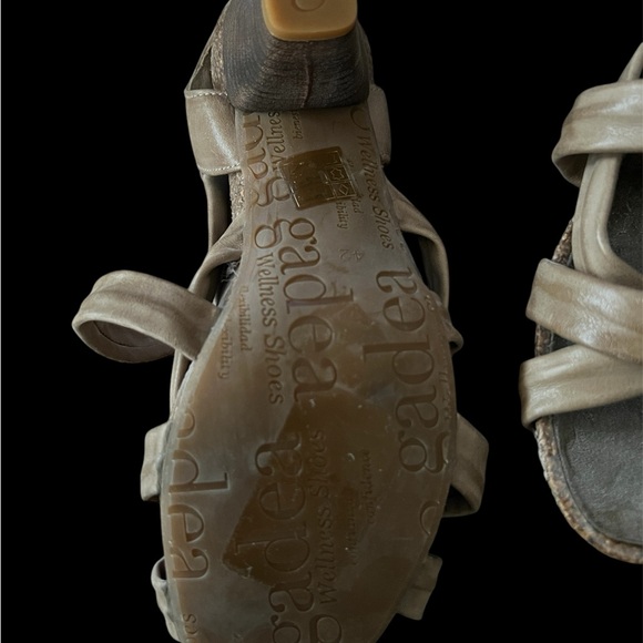 Tan sandals with open-toe design and intricate strap pattern - Picture 3 of 4